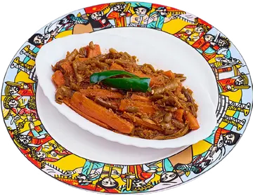 Fosolia green beans and carrots on a plate with injera.