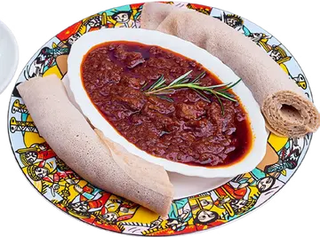 Red Key Wot stew with a roll of injera.
