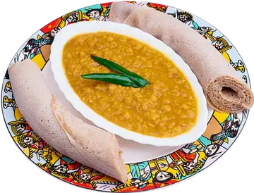 Yellow Kik Wot with a green pepper and injera.