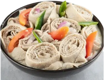 Suf Fitfit injera rolls with tomato and green peppers.