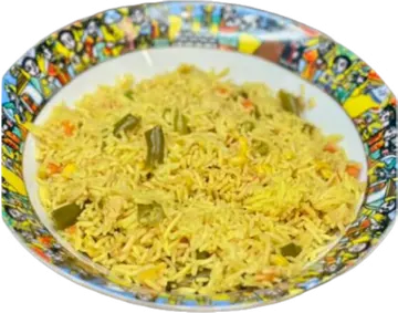 Yellow vegetable rice on a patterned plate.